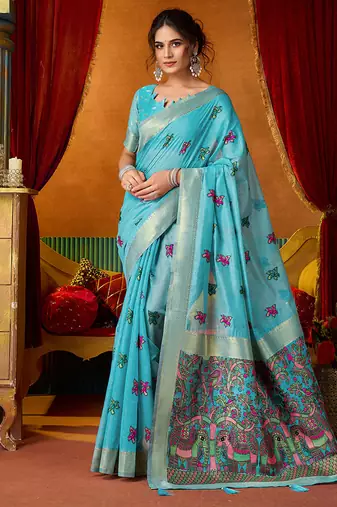Sky blue cotton blend saree with traditional ethnic motifs and includes blouse piece