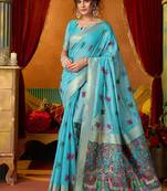 Sky blue cotton blend saree with traditional ethnic motifs and includes blouse piece