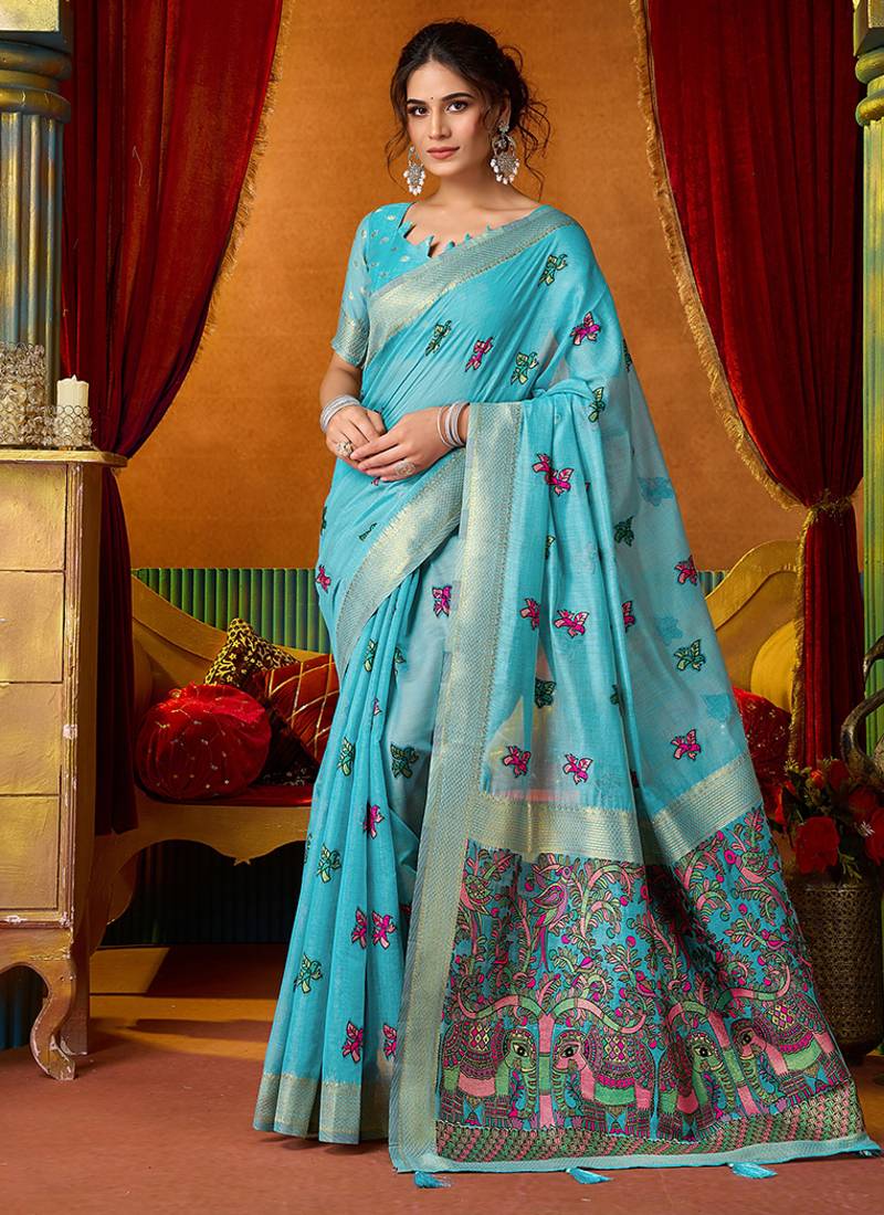 Sky blue cotton blend saree with traditional ethnic motifs and includes blouse piece