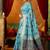 Sky blue cotton blend saree with traditional ethnic motifs and includes blouse piece