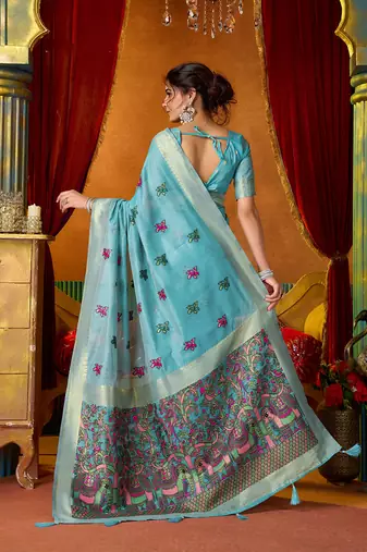 Sky blue cotton blend saree with traditional ethnic motifs and includes blouse piece