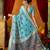 Sky blue cotton blend saree with traditional ethnic motifs and includes blouse piece