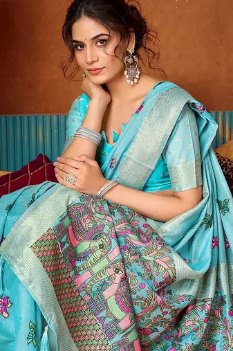 Sky blue cotton blend saree with traditional ethnic motifs and includes blouse piece