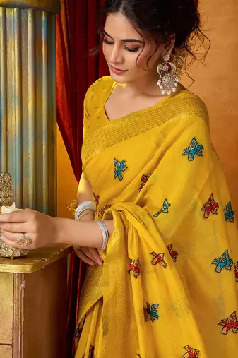 Mustard cotton blend saree with traditional ethnic motifs and includes blouse piece