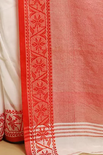 white saree with traditional woven border design