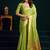 Light green cotton blend saree with floral meenakari pallu and gold zari border