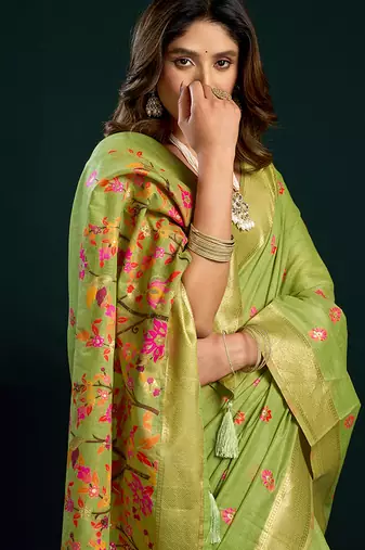 Light green cotton blend saree with floral meenakari pallu and gold zari border