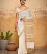 Off white ethnic motif woven design zari pure cotton kasavu saree