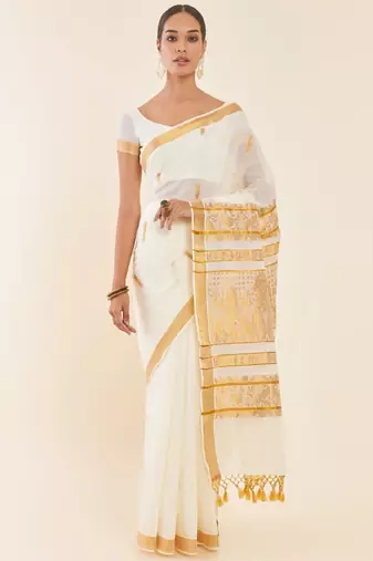 Off white ethnic motif woven design zari pure cotton kasavu saree