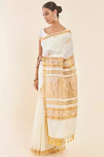 Off white ethnic motif woven design zari pure cotton kasavu saree