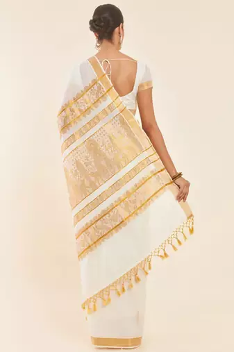 Off white ethnic motif woven design zari pure cotton kasavu saree