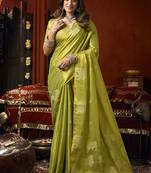 Lime green tissue silk blend saree with cow butta weaving work
