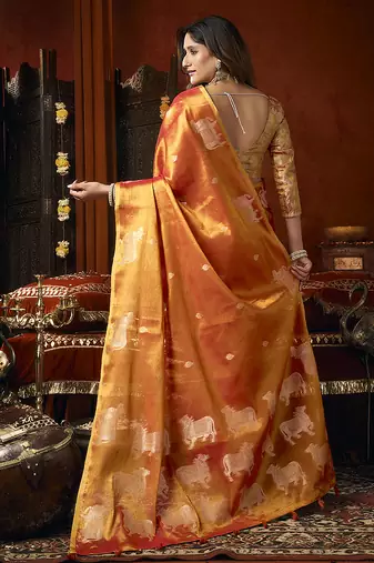 Orange tissue silk blend saree with cow butta weaving work