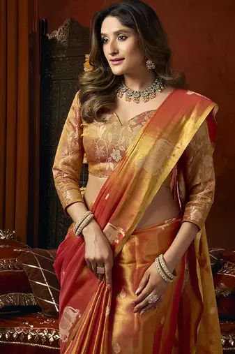 Orange tissue silk blend saree with cow butta weaving work