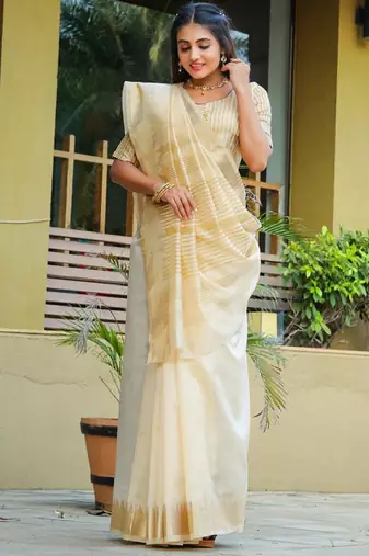 Cream-coloured zari detailed silk cotton saree