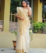 Cream-coloured zari detailed silk cotton saree
