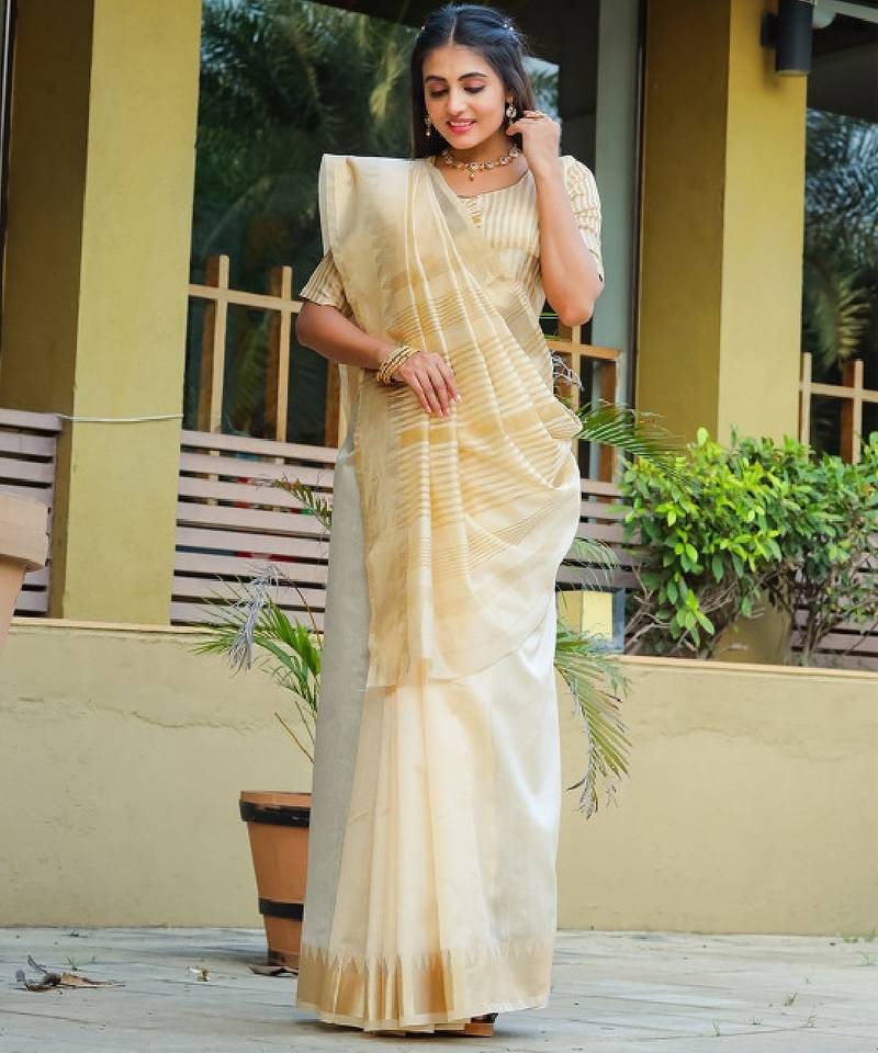 Cream-coloured zari detailed silk cotton saree