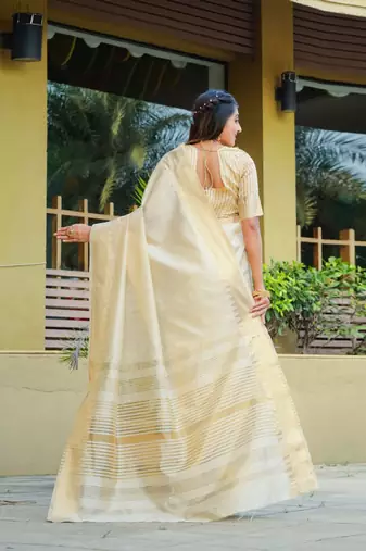 Cream-coloured zari detailed silk cotton saree