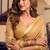 Beige cotton blend saree with litchi work & tassels