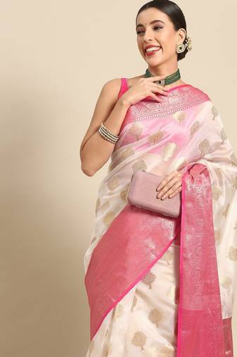 white saree with ethnic motifs zari kasavu work
