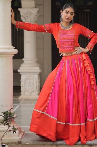 Orange Navaratri Special Mirror Lace Work Lehenga with Gamthi & Cowrie Lace work Choli