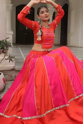 Orange Navaratri Special Mirror Lace Work Lehenga with Gamthi & Cowrie Lace work Choli
