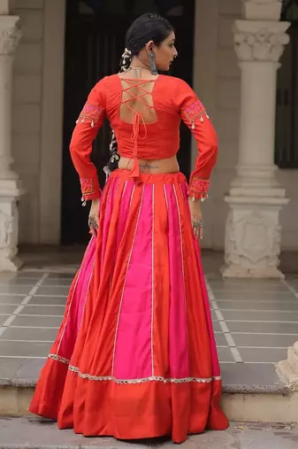 Orange Navaratri Special Mirror Lace Work Lehenga with Gamthi & Cowrie Lace work Choli