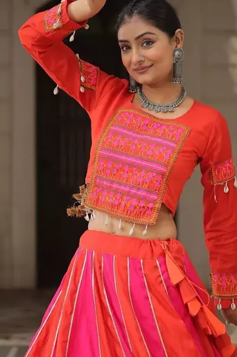 Orange Navaratri Special Mirror Lace Work Lehenga with Gamthi & Cowrie Lace work Choli