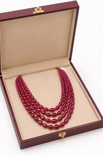 PRECIOUS OVAL SHAPE RUBIES WITH 4 STRANDS 