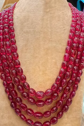 PRECIOUS OVAL SHAPE RUBIES WITH 4 STRANDS 