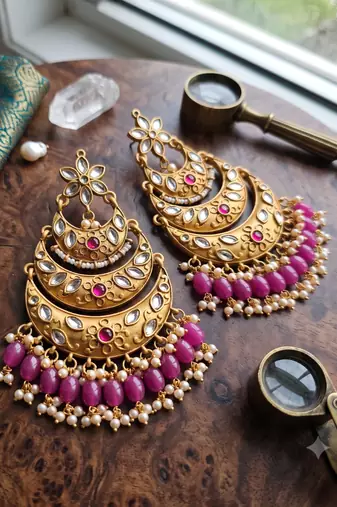 Traditional gold-toned layered chandbali earrings with pink kundan drops