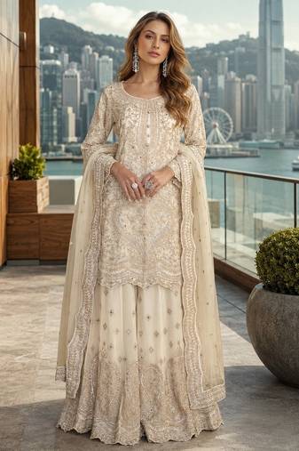 White net free size stitched suit with embroidery & hand work