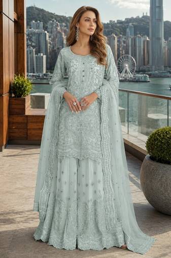 Blue net free size stitched suit with embroidery & hand work