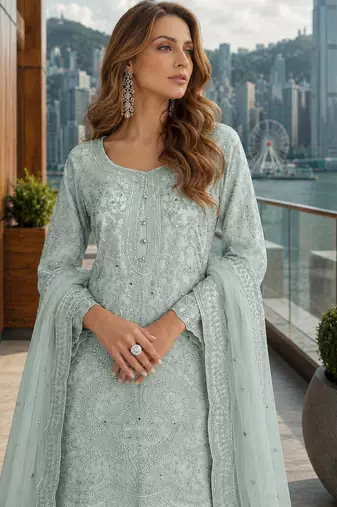 Blue net free size stitched suit with embroidery & hand work