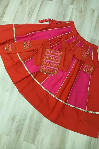 Orange Navaratri Special Mirror Lace Work Lehenga with Gamthi & Cowrie Lace work Choli