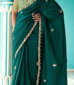 Dark green embroidery work fancy fabric saree with blouse