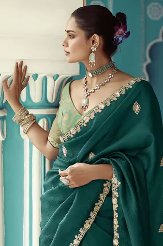 Dark green embroidery work fancy fabric saree with blouse