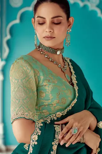 Dark green embroidery work fancy fabric saree with blouse