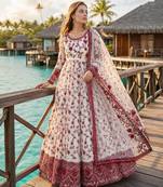 Red & white faux georgette suit with embroidery & tassels attached