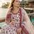 Red & white faux georgette suit with embroidery & tassels attached