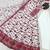 Red & white faux georgette suit with embroidery & tassels attached