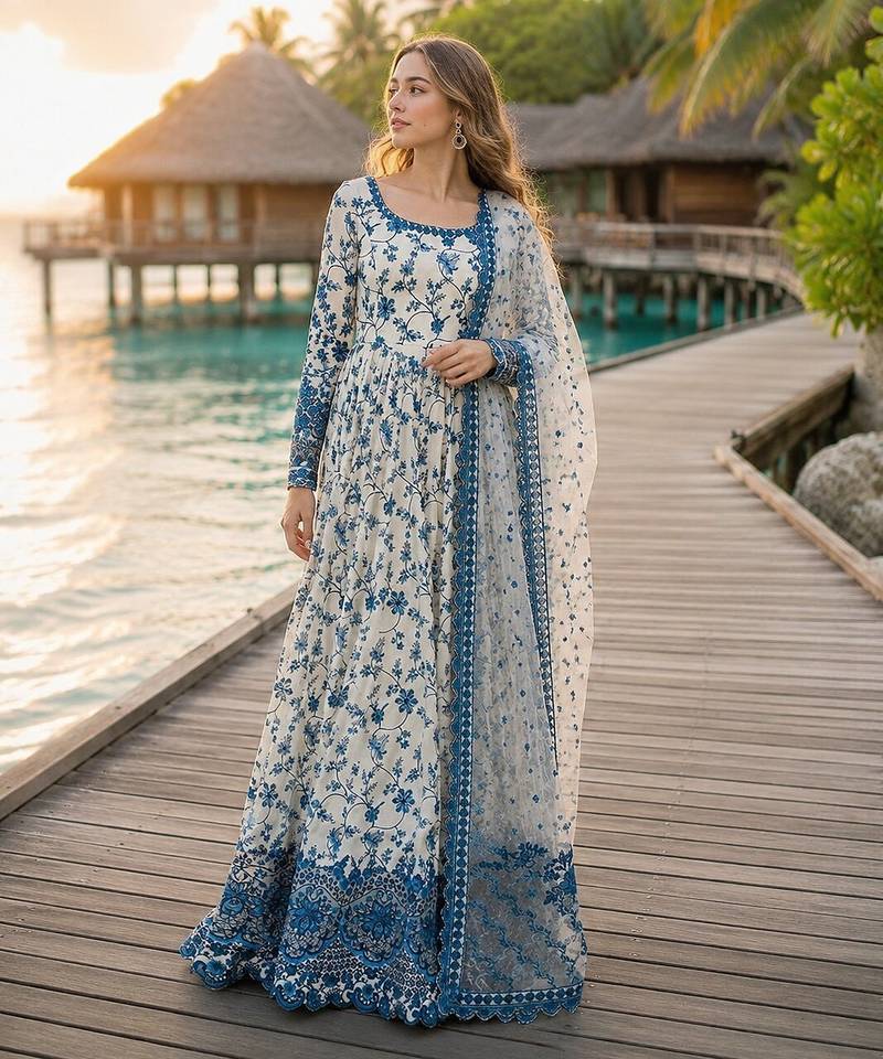 Blue & white faux georgette suit with embroidery & tassels attached