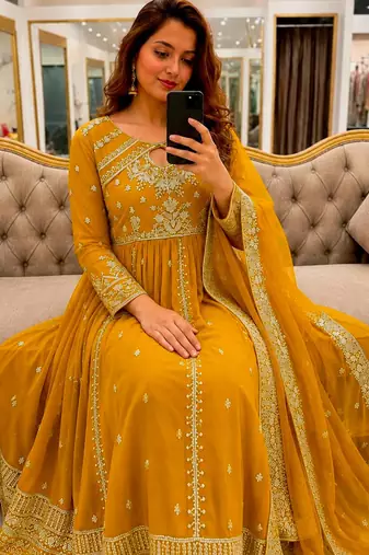 Yellow faux georgette sequins  free size flared gown set