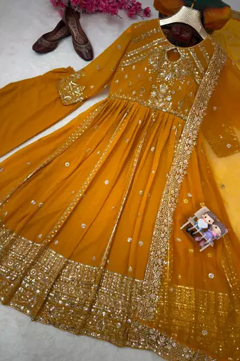 Yellow faux georgette sequins  free size flared gown set