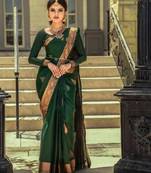 Green art silk woven saree with zari work