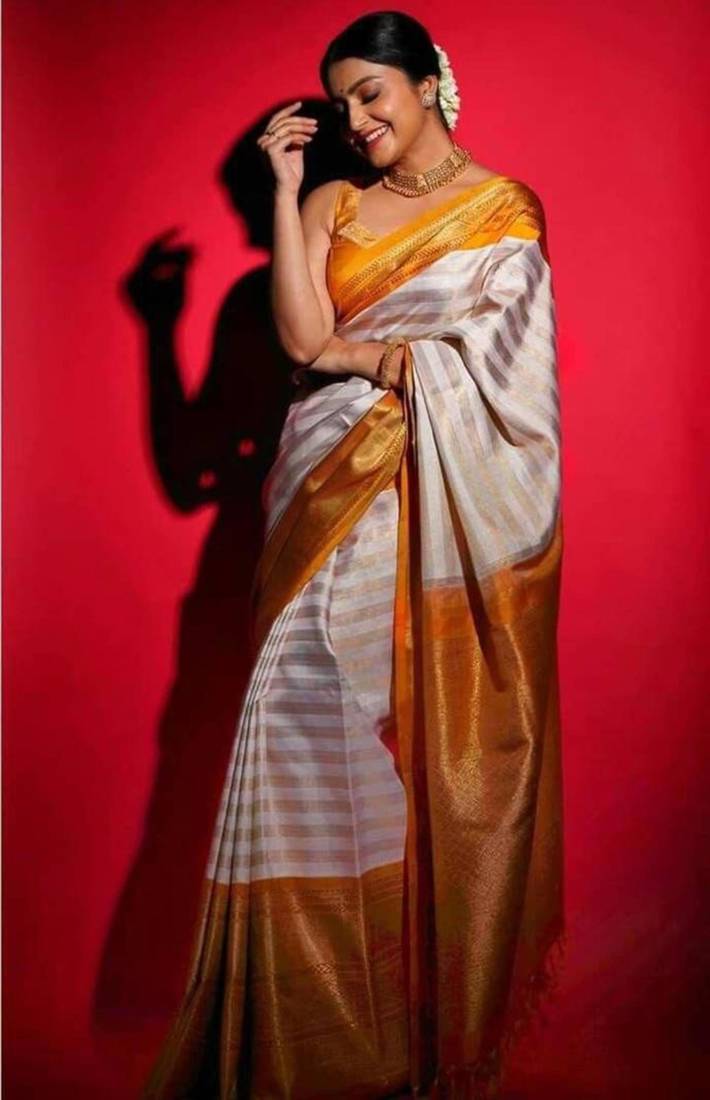 Off white art silk woven saree with zari work