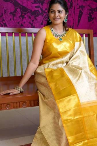 Light yellow art silk woven saree with zari work