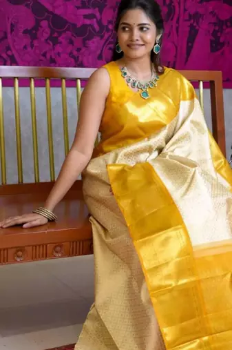 Light yellow art silk woven saree with zari work