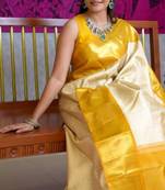 Light yellow art silk woven saree with zari work
