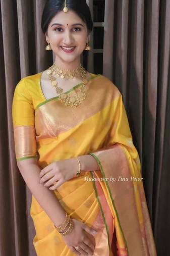 Yellow art silk woven saree with zari work
